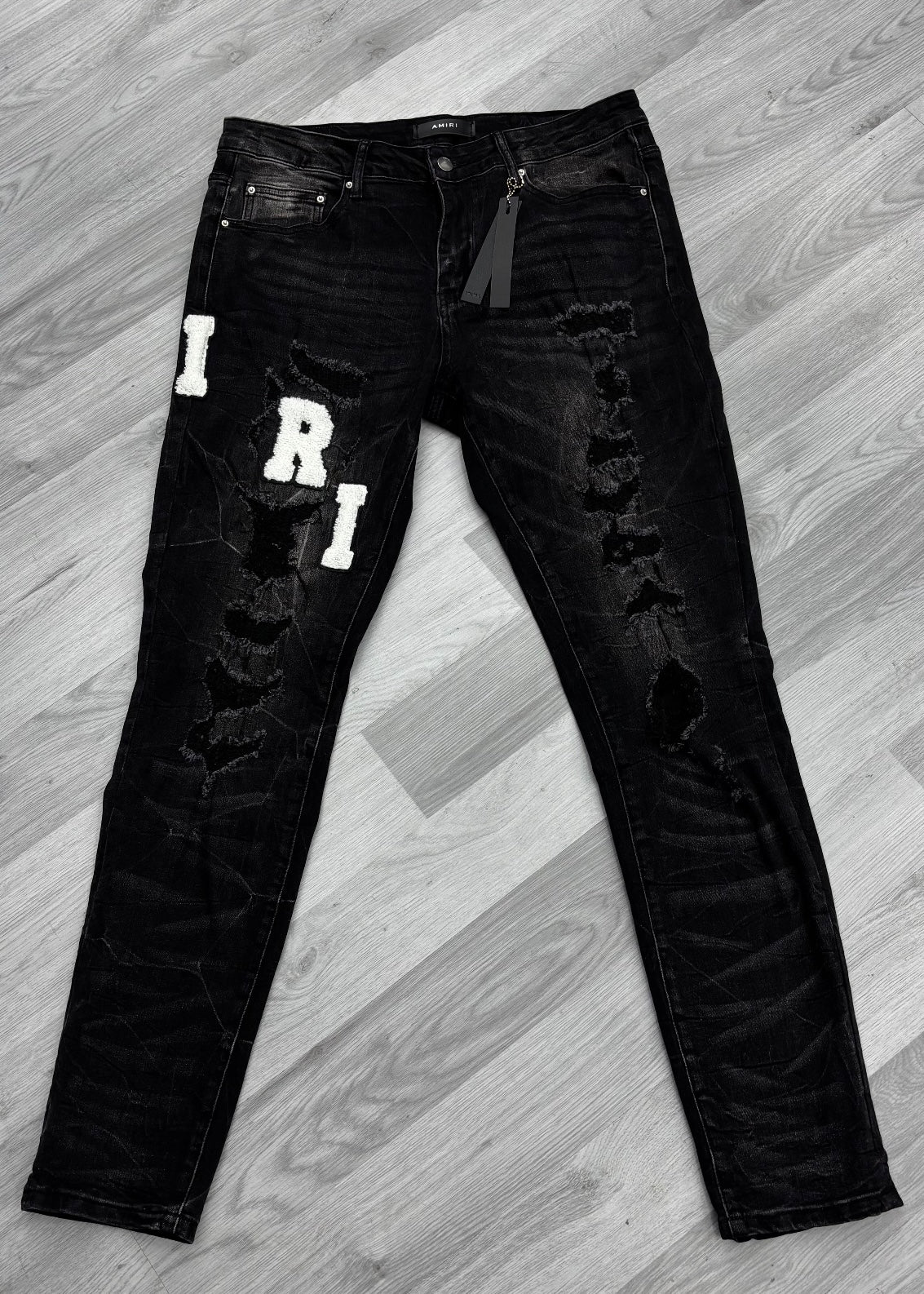Amiri Varsity Logo Ripped Black Jeans