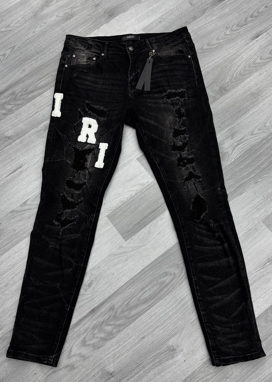 Amiri Varsity Logo Ripped Black Jeans